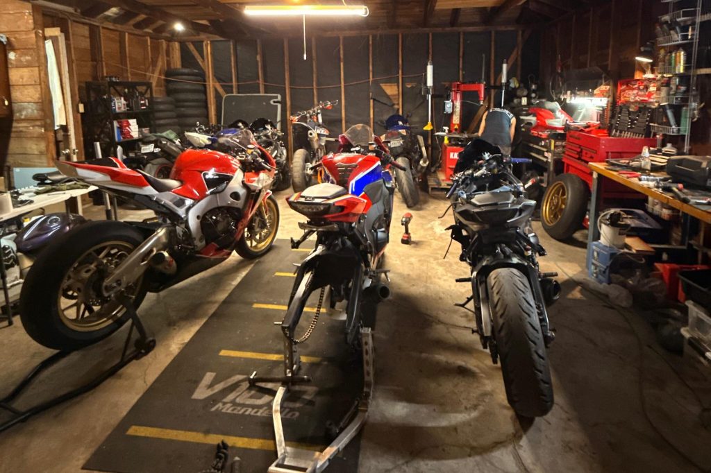 Inside the GPR Motorcycles workshop with several sports bikes under repair
